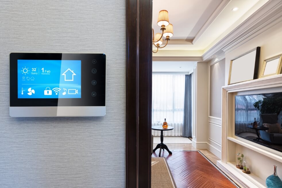 a thermostat with a digital touch display in a nice home