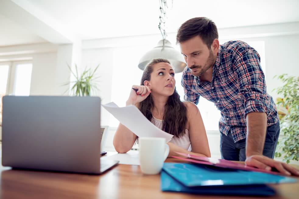 couple looking at utility bills